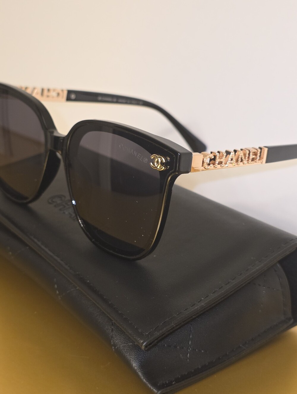 CHANEL Black Sunglasses with Gold Chain-Style Temples